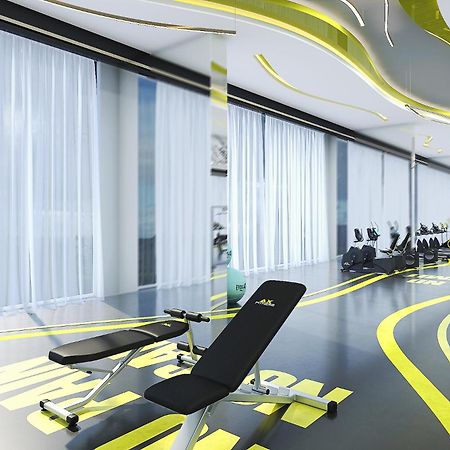 Royal M Al Aqah Beach Resort By Gewan Kültér fotó The gym at the hotel