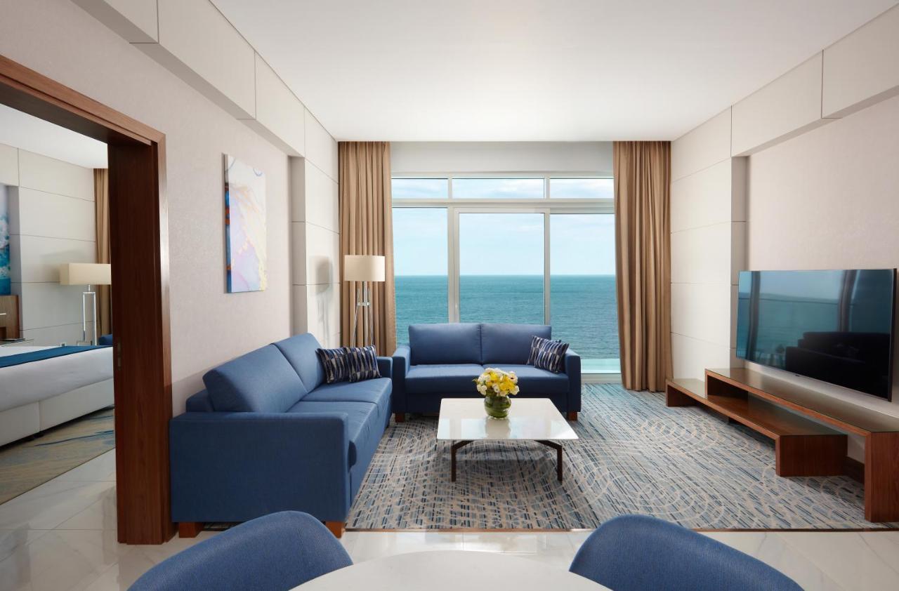 Royal M Al Aqah Beach Resort By Gewan Kültér fotó A living room at the hotel