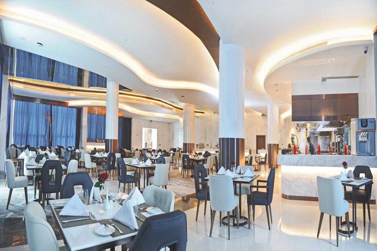 Royal M Al Aqah Beach Resort By Gewan Kültér fotó The restaurant